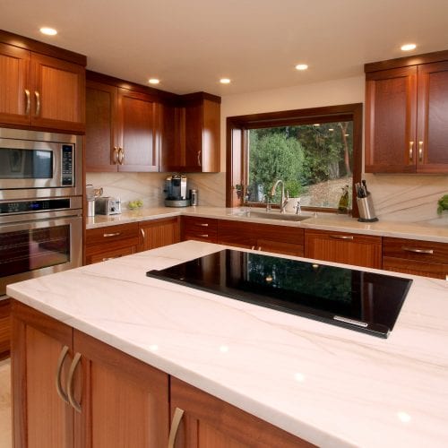 Electric stove embedded into marble counter