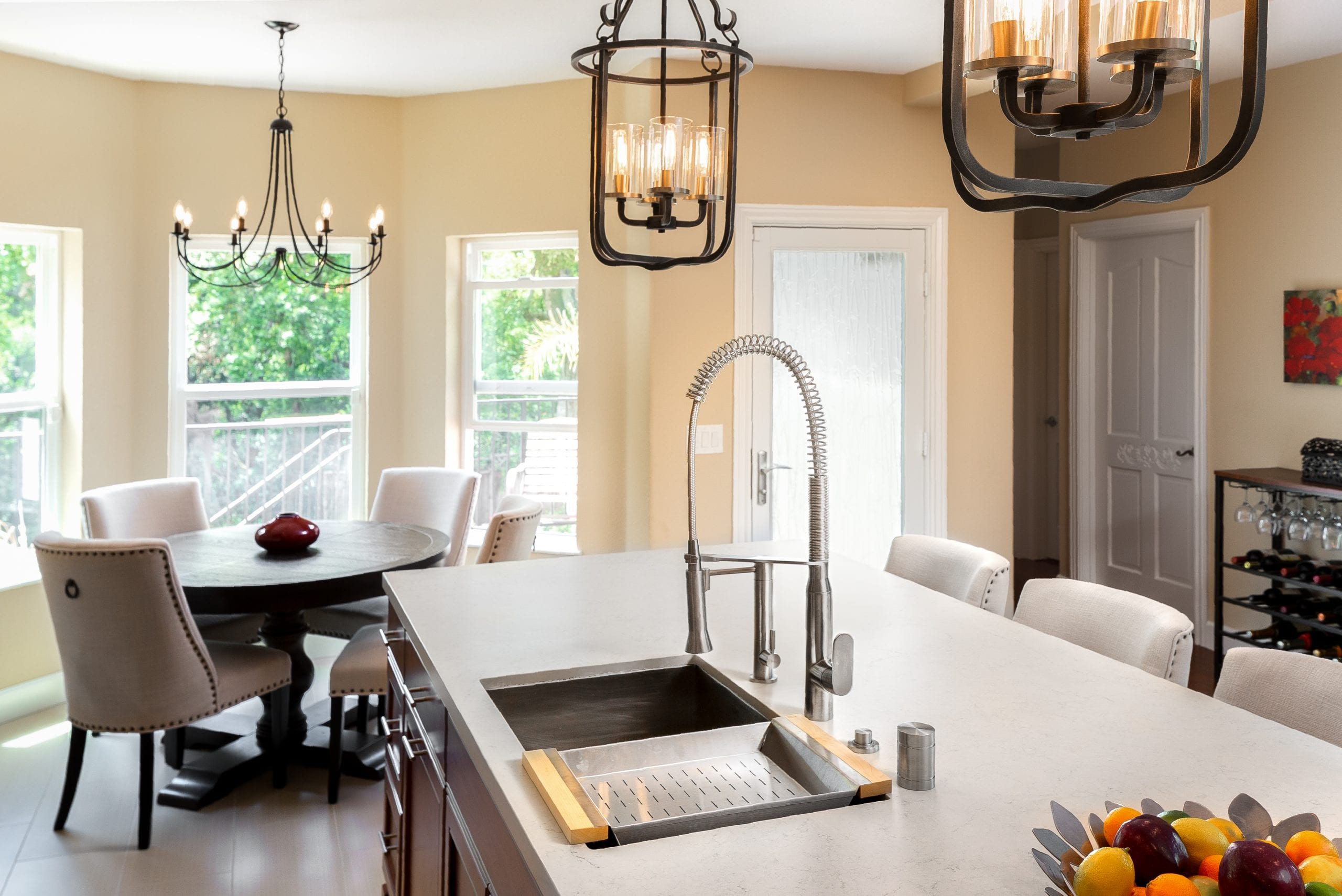 Stainless steel sink embedded into white marble countertop