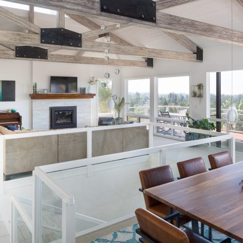 Kitchen that flows into living space with staircase in between