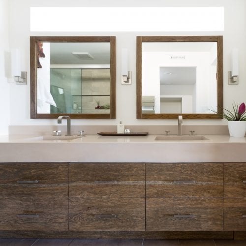 Bathroom with two square framed mirrors and two sinks