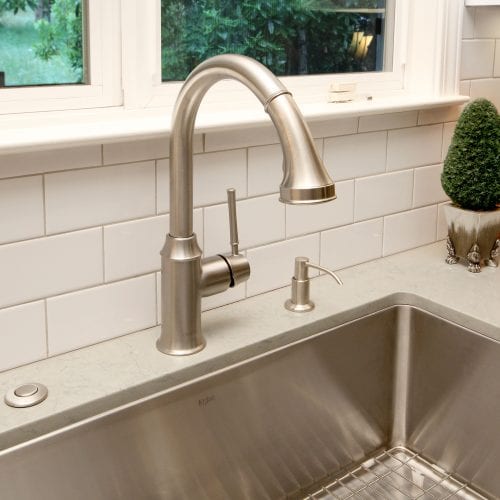 Stainless steel kitchen sink with detachable faucet head