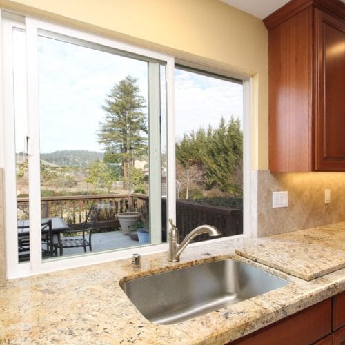 Kitchen sink with a half open sliding window pane