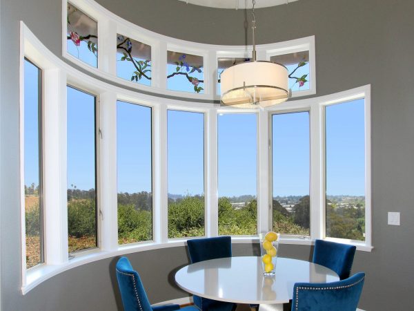 Dining room with many windows to allow in natural light