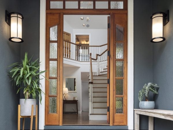 Wooden doorway with many glass panels lining the frame