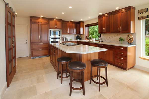 Kitchen with wooden finished cabinets and white countertops