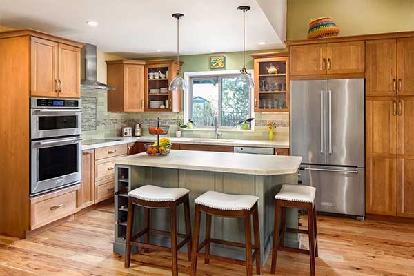 Kitchen with wooden cabinets, a white countertop and stainless steel appliances