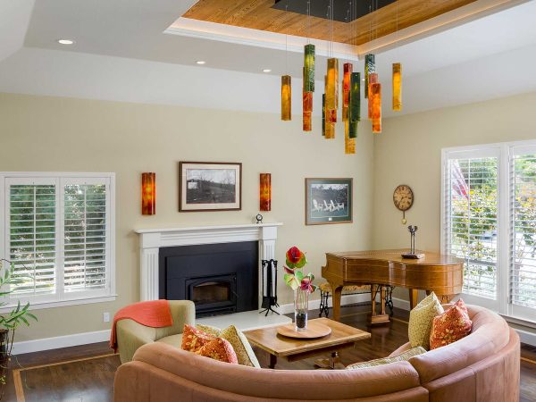 Warm living room with orange furniture and decor and built-in fireplace